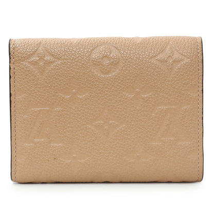 Exclusive Louis Vuitton Beige Empreinte Zoe Wallet — Side View