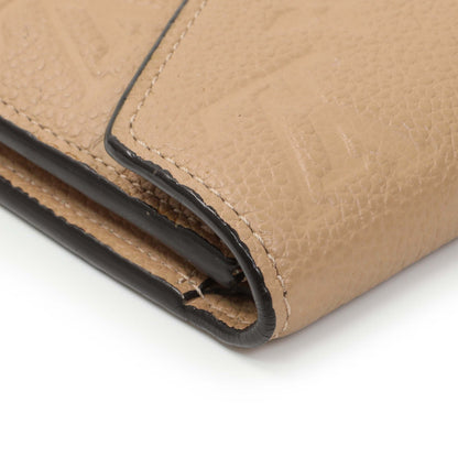 Exclusive Louis Vuitton Beige Empreinte Zoe Wallet — Lifestyle View