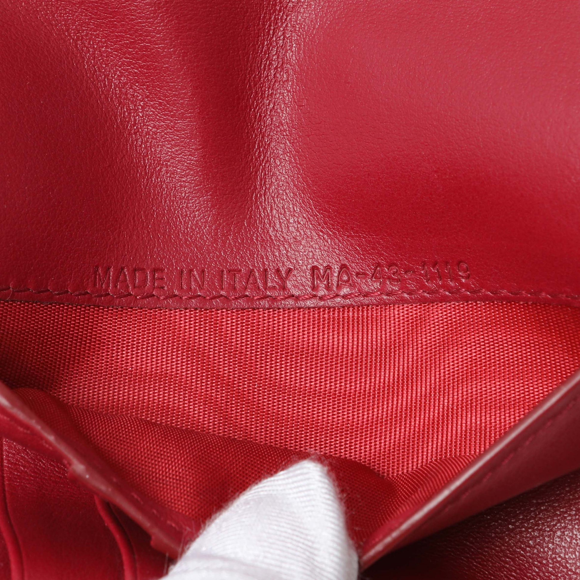 Exclusive Christian Dior Red Oblique Passport Holder — Lifestyle View