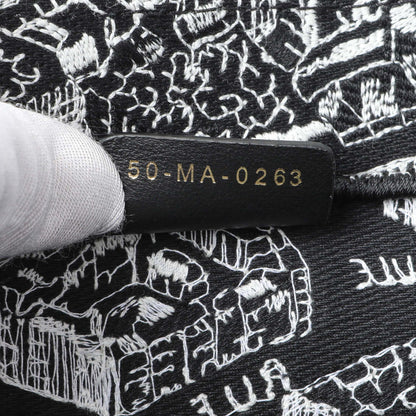 Exclusive Christian Dior Black White Canvas Embroidered Plan De Paris Medium Book Tote — Lifestyle View