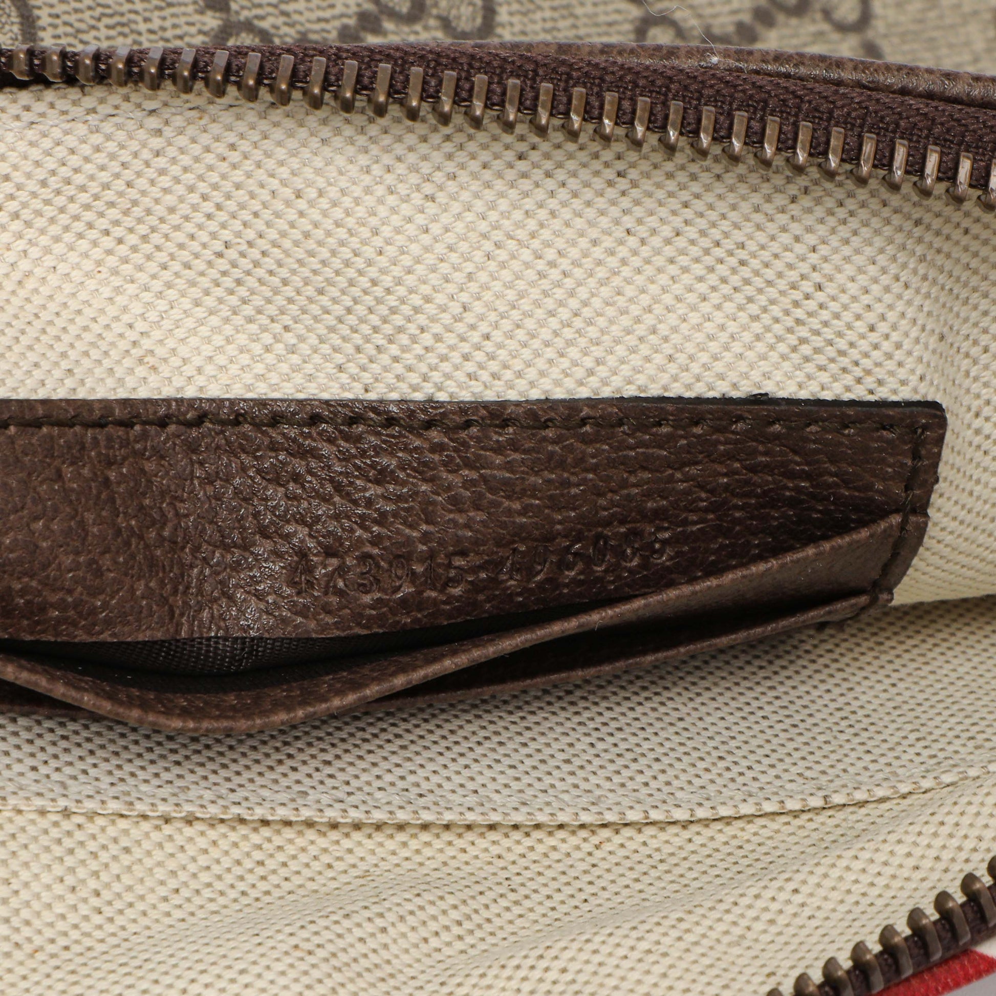Exclusive Gucci GG Supreme Monogram Courrier Neo Vintage Zip Wristlet — Lifestyle View