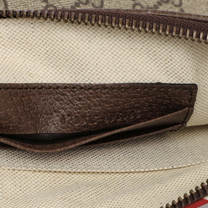 Exclusive Gucci GG Supreme Monogram Courrier Neo Vintage Zip Wristlet — Lifestyle View