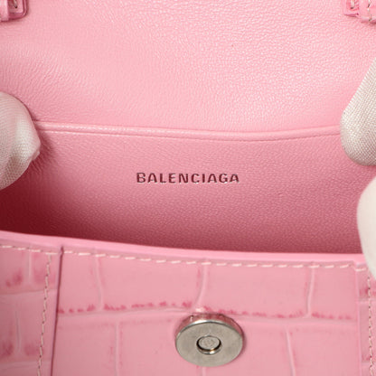 Exclusive Balenciaga Pink Crocodile Embossed Shiny Calfskin Mini Hourglass Top Handle Bag — Lifestyle View