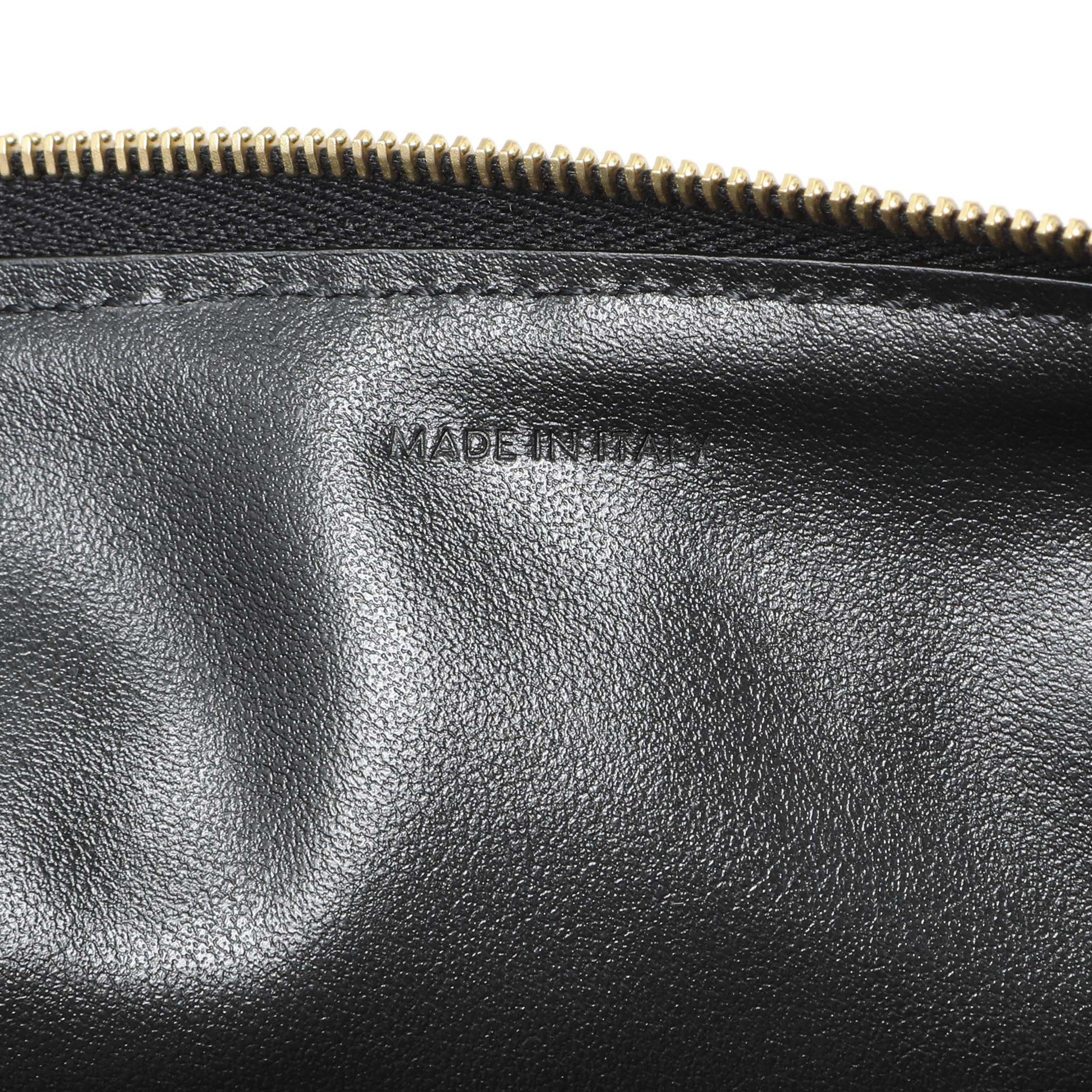 Exclusive Celine Black Calfskin Quilted C Charm Pouch — Lifestyle View