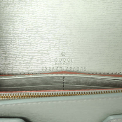 Exclusive Gucci Pale Green Textured Calfskin Script Logo Chain Wallet — Lifestyle View