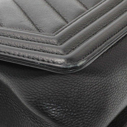 Exclusive Chanel Black Chevron Quilted Caviar Medium Boy Flap — Lifestyle View