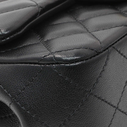 Exclusive Chanel Black Mini Rectangular Flap Bag with Camellia Adjusting Chain — Detail View