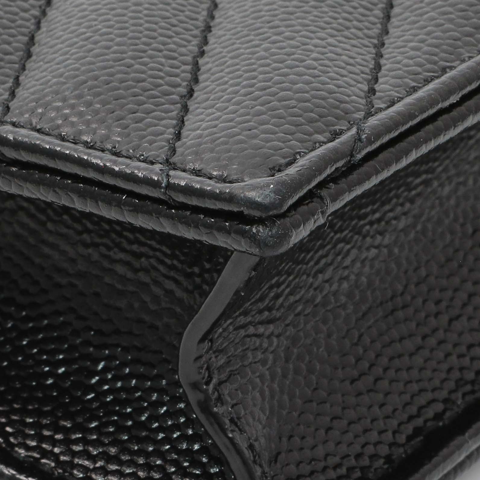 Exclusive Saint Laurent Black Grain De Poudre Matelasse Chevron Monogram Envelope Chain Wallet — Lifestyle View