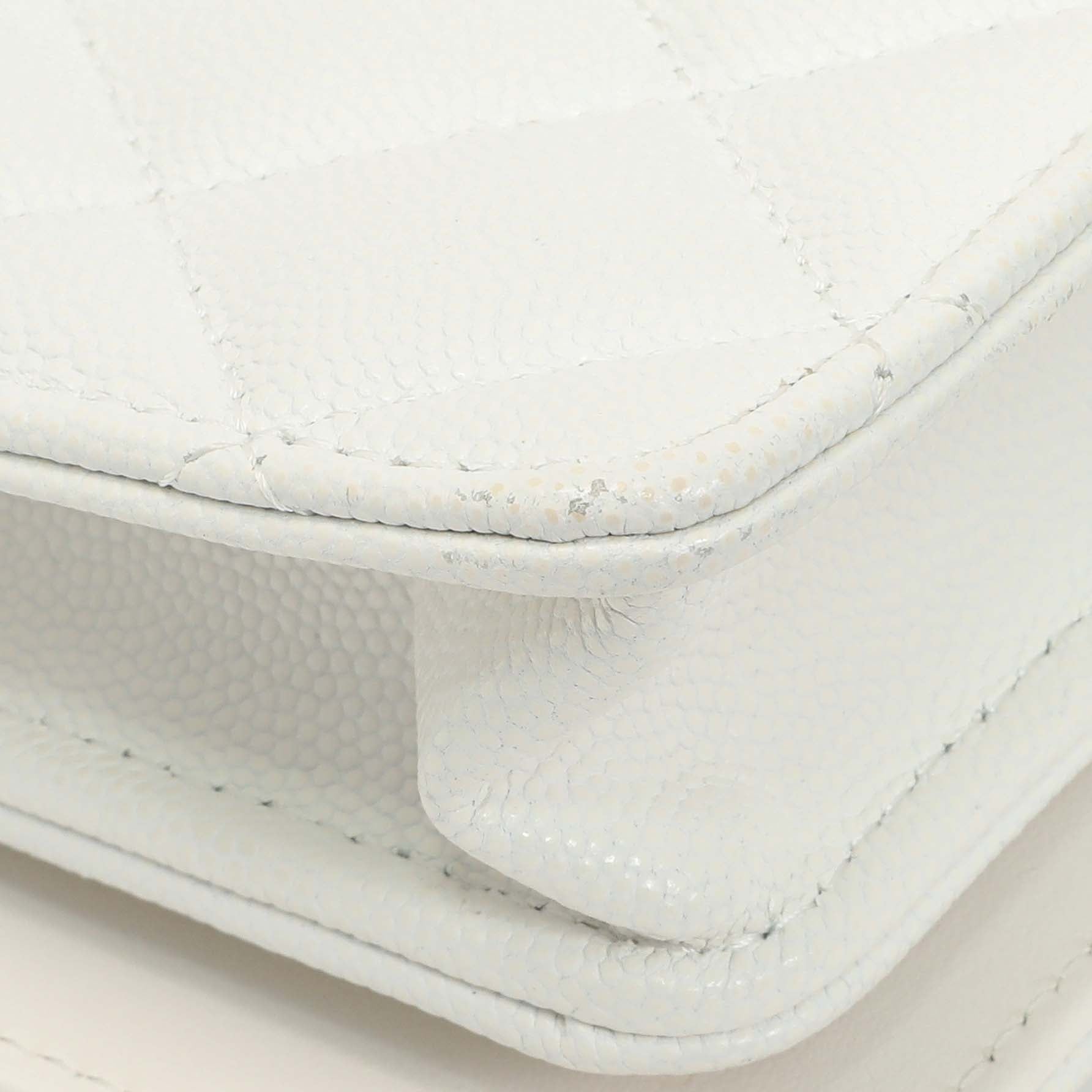 Exclusive Chanel White Quilted Caviar Camellia Chain Flap — Lifestyle View