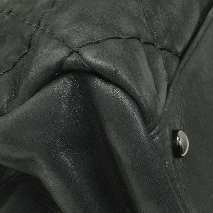 Exclusive Chanel Black Iridescent Calfskin Quilted Large Just Mademoiselle Bowling Bag — Lifestyle View