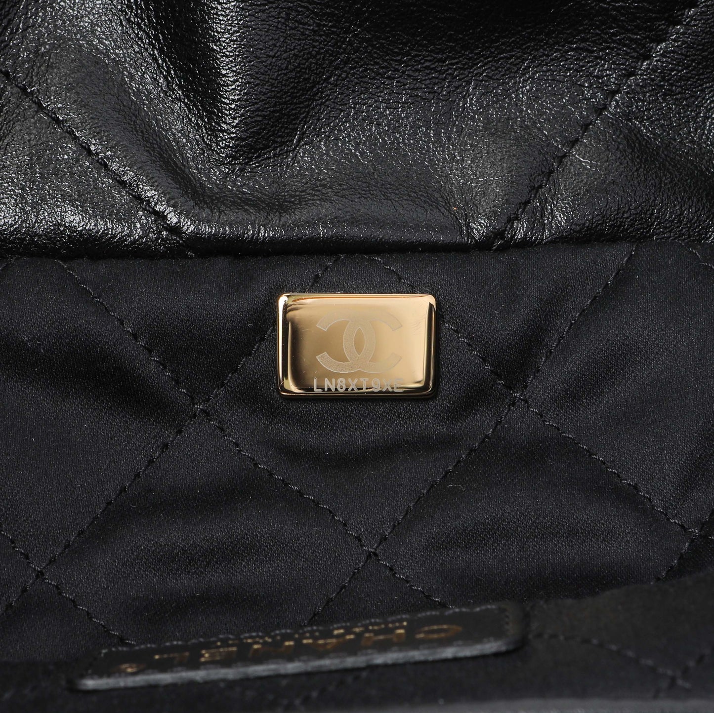 Exclusive Chanel Black Quilted Shiny Calfskin Small Chanel 22 — Lifestyle View