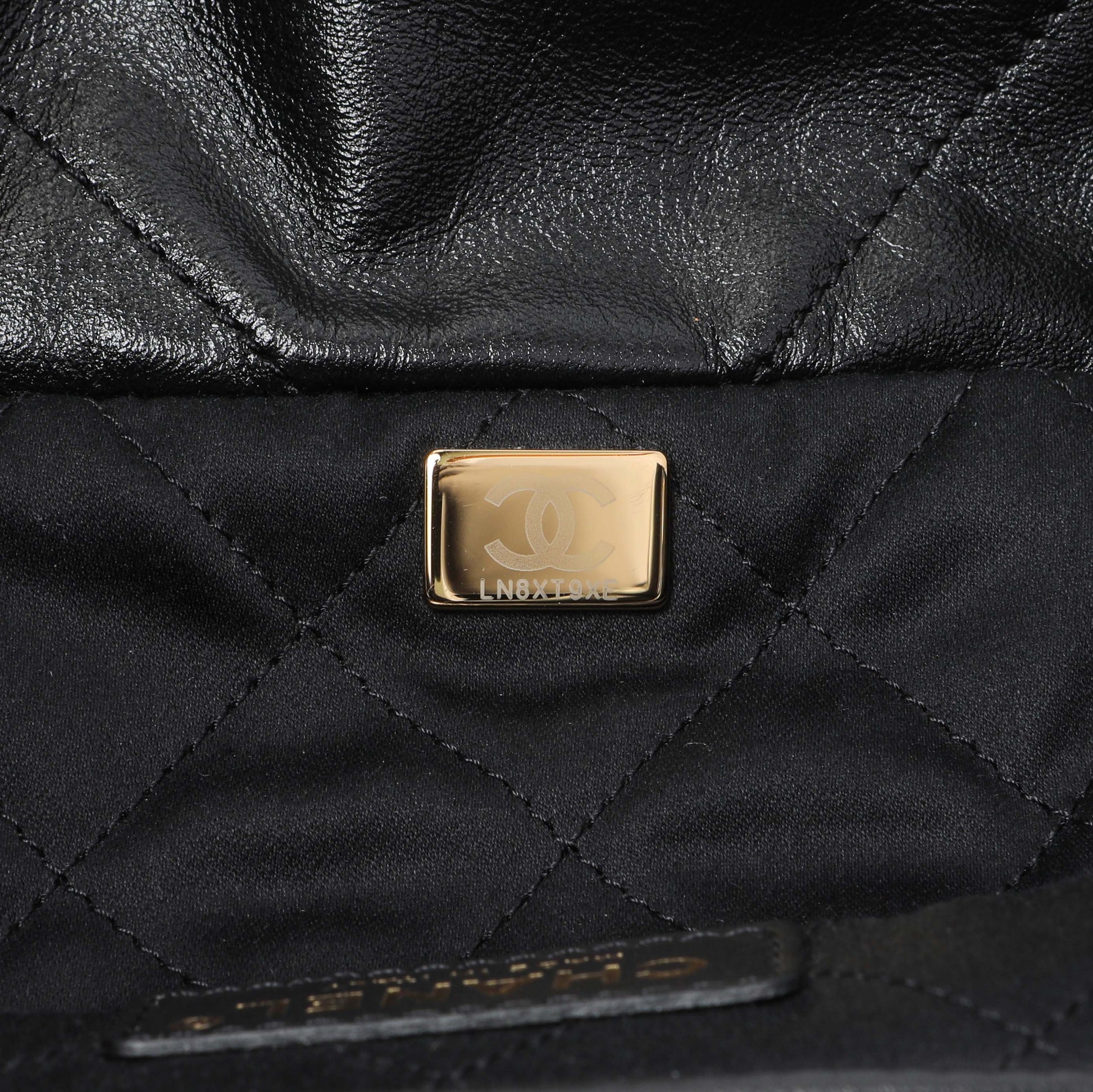 Exclusive Chanel Black Quilted Shiny Calfskin Small Chanel 22 — Lifestyle View