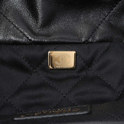 Exclusive Chanel Black Quilted Shiny Calfskin Small Chanel 22 — Lifestyle View
