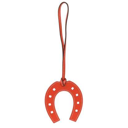 Exclusive Hermes Orange Swift Paddock Horseshoe Bag Charm — Front View