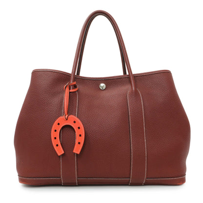 Exclusive Hermes Orange Swift Paddock Horseshoe Bag Charm — Back View