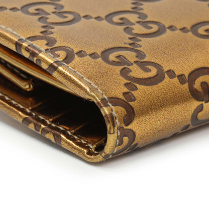 Exclusive Gucci Bronze Guccissima Compact Wallet — Lifestyle View