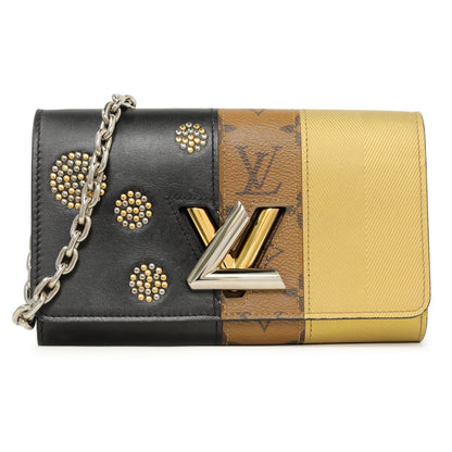 Exclusive Louis Vuitton Reverse Monogram Studded Night Lights Twist Chain Wallet — Front View